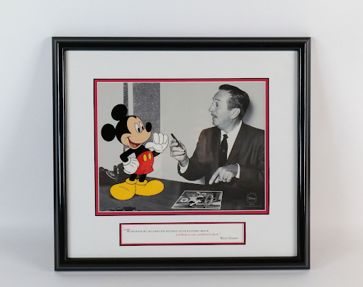 An original print of Walt Disney pretending to be working with Mickey Mouse. Mickey is colorized, while Walt is in black and white.