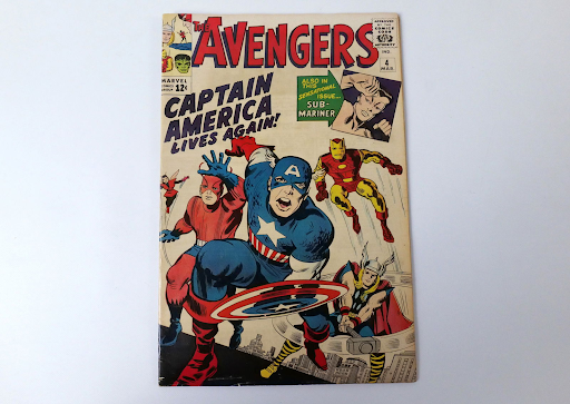 An original comic book of the Avengers is pictured featuring the return of Captain America.