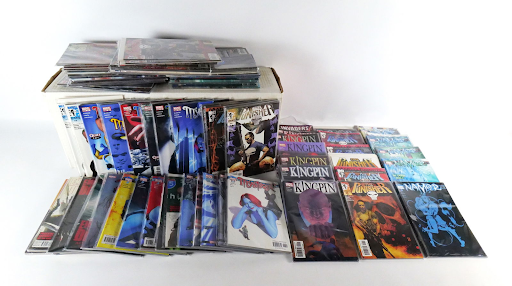 A collection of various comic books is pictured.